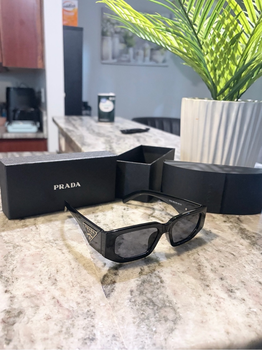 Prada Glossy Black Triangle-Logo Sunglasses